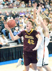 Will Tschetter is fouled on an inside move while attacking the rim.