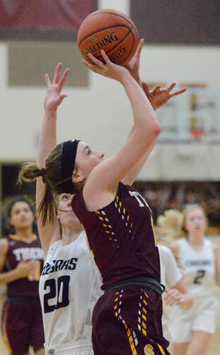 Lily Welch breaks baseline, beating a ZM defender, then stops and pops a six-foot jumper.