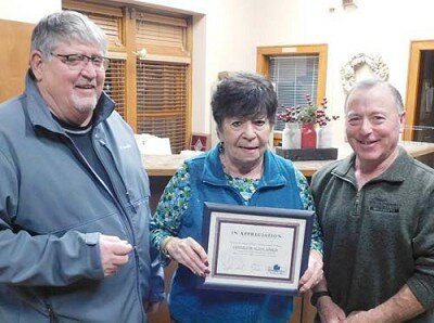 Sharon McAtee, site coordinator for the Center for Active Adults, center, accepts the Stewartville Economic Development Authority’s Business Appreciation Award from Jim Kuisle, president of the EDA, left, and Mayor Jimmie-John King, EDA member, right.