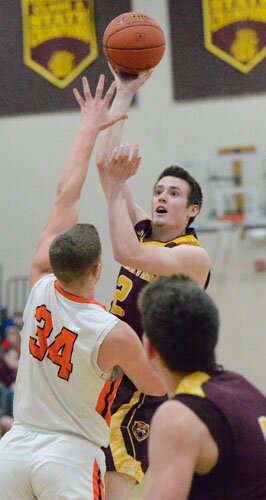 Bradon Holschlag fakes the pass down low to Tschetter and hooks this shot over a Lake City defender.