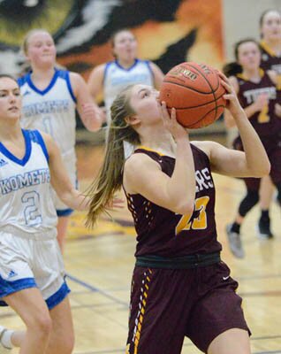 Ella Waltman eyes the hoop on a fastbreak bucket against KM.