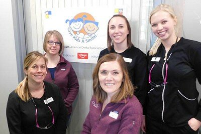 Zachary Lechner, DDS, and his staff offered Give Kids a Smile, free dental care to children from families without health insurance, on Friday, Feb. 7. Staff members include, front row, from left, Brianna Elwood, dental hygienist; and Katy Wiersma, office manager. Back row, from left, Cindy Tangen, administrative assistant; Kayla Gibson, dental assistant; and Jessica Riker, dental assistant. Normally, Root River Dental is closed on Fridays, but Lechner and his staff donated their time to the program.