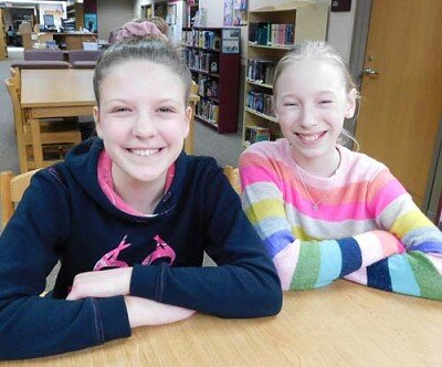 Sixth graders Alexa Buntrock, left, and Ignessa O’Byrne.