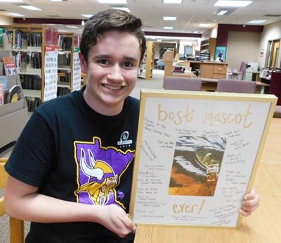 Brady Ploenzke, a sophomore at Stewartville High School, displays the Best Mascot Ever! Award he received from the Stewartville High School boys varsity basketball team. Below is Stewie, the Tiger mascot, with Ploenzke inside. “I live to be energetic,” Ploenzke said. “I’m always energetic.”