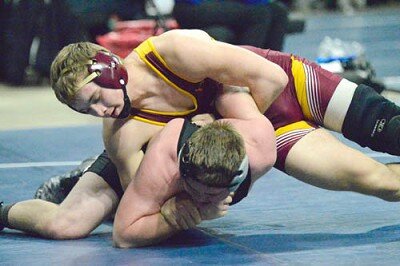 Christian Sackett bars up the arm of his 182-pound LARP quarterfinal opponent and circles to turn him, collecting back points enroute to a 5-1 decision at the Section 1AA individual championships.