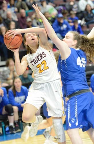 Jolie Stecher is fouled by a Cotter defender going up aggressively under the iron.