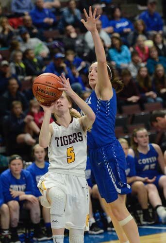 Kailee Malone eyes the hoop as she drives for a baseline bucket after beating a Cotter defender.