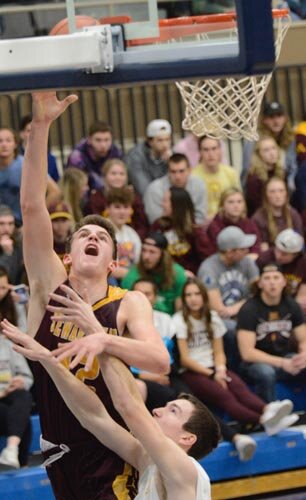 Will Tschetter hooks the one-hander in, fighting off the PEM foul with his left arm for two of his 41 points.