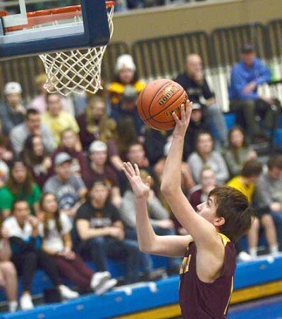 Kaleb Hellickson breaks down the baseline for an easy bucket against PEM.