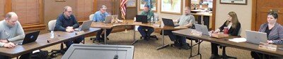 he City Council met at Stewartville City Hall on Tuesday April 14. Mindful of social distancing due to the coronavirus (COVID-19) pandemic, Council members and city staffers sat six feet from each other, including, from left, councilpersons Josh Arndt and Brent Beyer, Mayor Jimmie-John King, councilpersons Craig Anderson and Jeremiah Oeltjen; Karla Strain, finance director, and Cheryl Roeder, city clerk.
