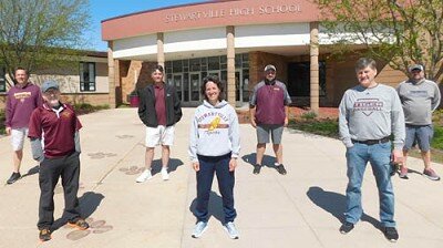 When Gov. Walz announced on Thursday, April 23 that the coronavirus (COVID-19) pandemic would limit Minnesota’s schools to distance learning for the rest of the 2019-20 school year, the coaches of Stewartville High School’s seven spring sports knew that the senior athletes under their guidance would be deprived of their final season of competition. The coaches, observing social distancing guidelines, include, front row, from left, Kelly Manley, boys tennis; Dawn Miller, girls track; and Mark Schmitz, baseball. Back row, from left, Curt Hughes, softball; Dave Honsey, boys golf; Todd Lechtenberg, girls golf; and Aaron Meyer, boys track.