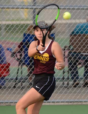 Chloe Regal uses quick footwork to make this baseline return against her Cannon Falls opponent.