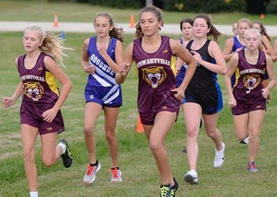 Norah Campbell (far left), Mia Peterson (3rd from left) and Ana Walters (3rd from right) work their way to the front of the pack near the start of the race at the Stewartville-hosted HVL triangular. 