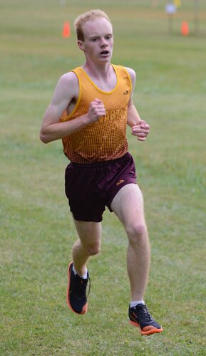 Caleb Goff blazes the 5K course to capture first place at the HVL triangular hosted by Stewartville.