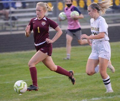 Sarah Watters breaks down the sideline to beat a Byron defender.