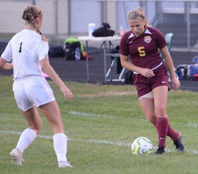 Ella Quam jukes to the side to beat a Byron defender before attacking the goal.