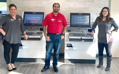 THE CREDIT UNION DIFFERENCE -- From left, First Alliant Credit Union- Stewartville branch employees Jessica Wampach, MEA-member experience advisor; Sunny Ahmed, MEA; and Hayley Howard, branch lead; stand near the Credit Unionís cutting-edge, advisory supported kiosks.