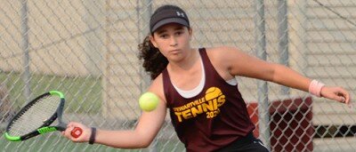No. 1 Singles player Chloe Regal slices a baseline return.