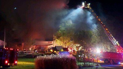 Stewartville firefighters used the departmentís newly purchased aerial truck to knock down a fire at Jon Nelsonís property in High Forest on Oct. 9 and 10.