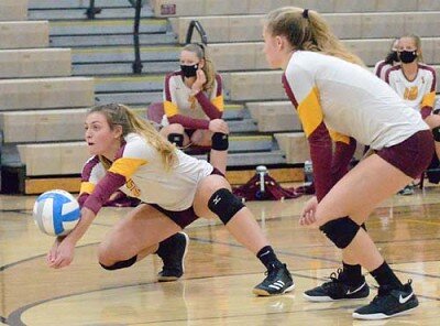 Jolie Stecher squares her shoulders and lunges to dig this Byron attack.