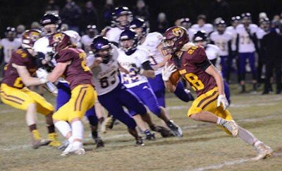 Tiger wide receiver Will Laures (#28) scampers outside, gaining Y.A.C. (yards after catch) during a recent home game.