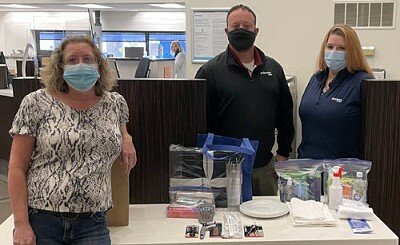 Debbie West, food and donations specialist at the Womens Shelter & Support Center in Rochester, left, picked up five Welcome Home kits at Bremer Bank in Stewartville last week from Mike Rainey, personal banker, center, and Nicole Magnuson, consumer banker.