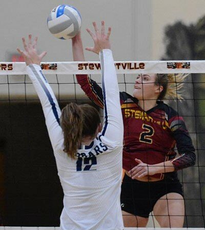 Jolie Stecher scores a Tiger point, pounding this kill through the block attempt.