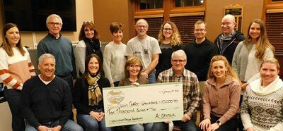 Tom and Sue Slightam, owners of Jimmys Salad Dressings & Dips, seated at left in the front row, have donated $10,000 to the Stewartville Area Community Foundation, which will distribute the money to the owners of the new Cabin Coffee shop in Stewartville, including, starting from third from left in the front row, Robin and Kevin Splittstoesser, Leigh Dzubay and Hannah Lechner. Community Foundation members include, standing from left, Regan Lonien, Jeff Beyer, Patty Geerdes, Lisa Lonien, Al Chihak, Kayla Beyer, Dan Honsey, Robert Hruska and Emily Fritsch. The money will come from the Slightams Low Water Bridge Foundation, established in 2017 to assist selected entrepreneurs with the startup phase of their businesses.
