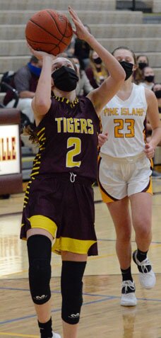 Haylie Strum breaks past a Pine Island defender for two of her game-high 20 points.