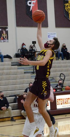 Nolan Stier skies high and floats through the lane on this running jumper to the rim against Cannon Falls.