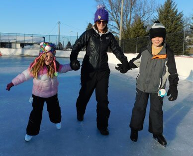 Crystal Landherr, center, brought her children, Mason and Emma, to Meadow Park last week, where the kids enjoyed ice skating for the first time, skimming across the city of Stewartville's new Dasher Board System 4 hockey rink on Tuesday afternoon, Feb. 2. 