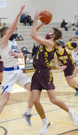 Nolan Stier drives from the wing and pops a quick jumper for two of his career-high 30 points against KM.