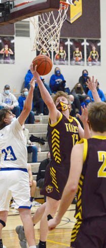 Miles Hettinger attacks the rim with this leaning layin against KM.
