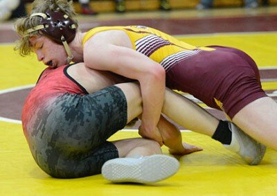Lucas Larson works this cradle to roll his Cannon Falls opponent on his back