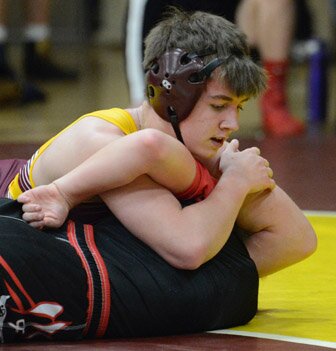 Patrick Foster bars an arm, lifts the head and drives the shoulder of his Cannon Falls opponent to the mat.