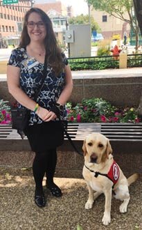 Cherish Grabau with Zane, her 6-year-old mobility assistance yellow Labrador. Zane helps Grabau with tasks that became more difficult after Grabau was diagnosed with multiple sclerosis.