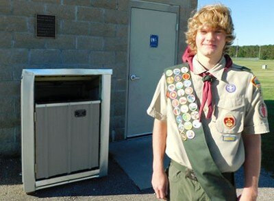 Jackson Struhar, a junior at Stewartville High School, above, completed his Eagle Scout project by supervising and working together with a group of fellow scouts to enclose four trash cans at Bear Cave Park with wooden framing, steel siding, galvanized trim and a roof.