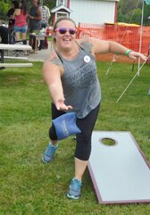 Nikki Roeder is one of scores of participants who took part in the annual beanbag tournament at High Forest Old Settlers Day on a warm and humid Saturday, Sept. 11.
