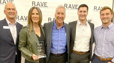 The Slightam Family, owner of Jimmys Salad Dressings & Dips, received the Lifetime Achievement Award at Rochester Area Economic Development, Inc.s (RAEDIs) eighth annual R.A.V.E. (Recognizing Awarding Valuing Entrepreneurs) event on Wednesday, Nov. 17. From left above are John Wade, RAEDIs president, and the Slightams, including Sue,Tom, Sam and Griffin.