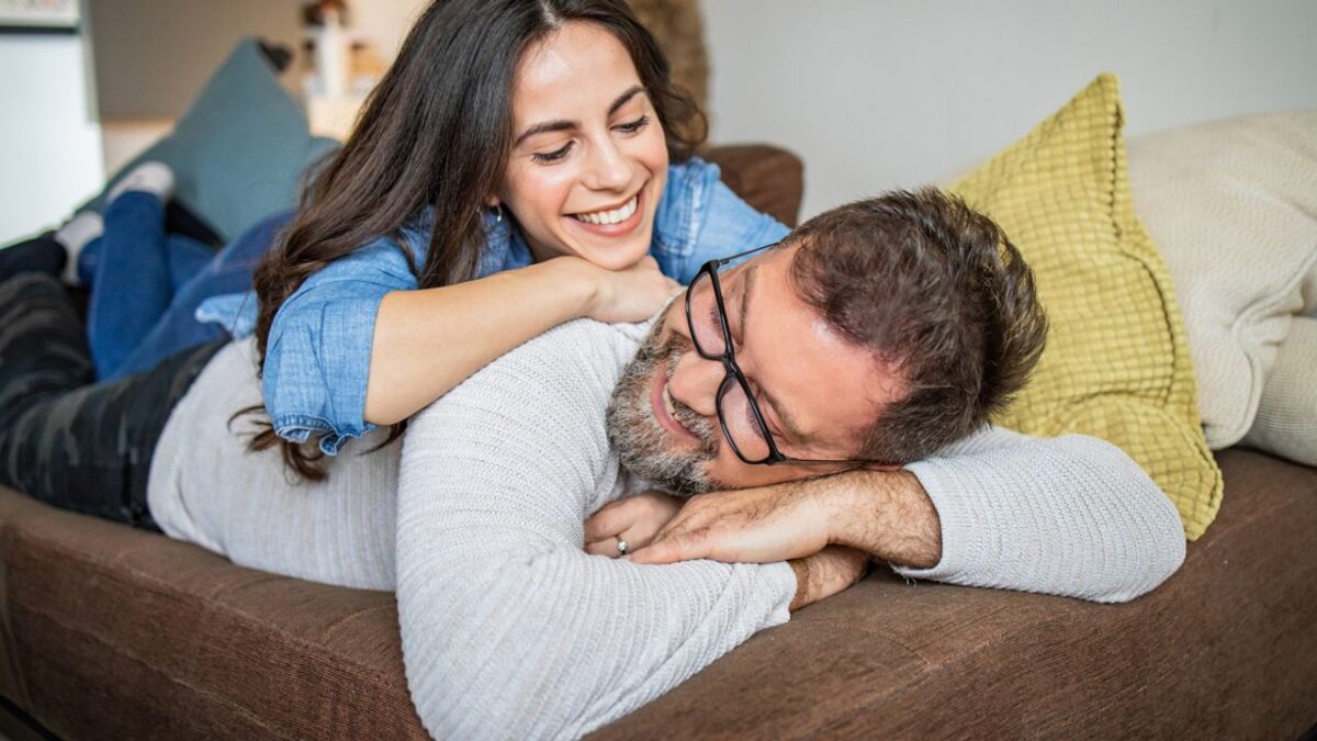 loving couple relaxing on the couch at home